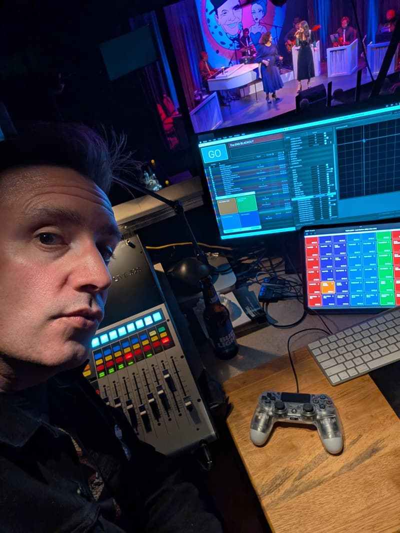 Garry Hall at a studio workstation with DAW screens and a fader controller